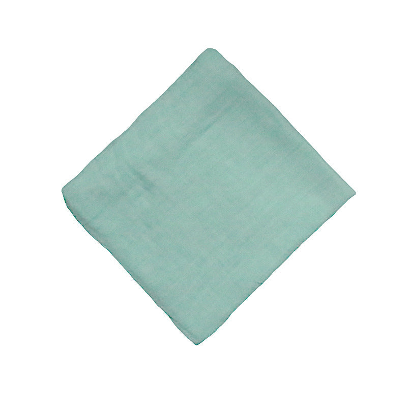 Bain en coton de bambou teint dans une serviette enveloppée de gaze